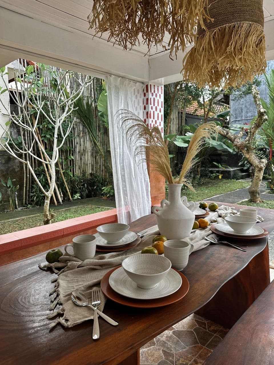 Outdoor dining table set for guests at an ATELIERO-managed villa